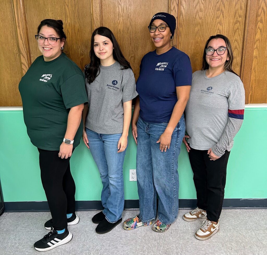 Four AmeriCorpse members standing next to each other facing the camera